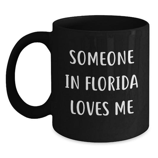 Someone in Florida Loves Me Funny Florida Gifts for Birthday, Black Coffee Mug from Friends, 'Someone In Florida Loves Me' Quote, Microwave and Dishwasher Safe - Main