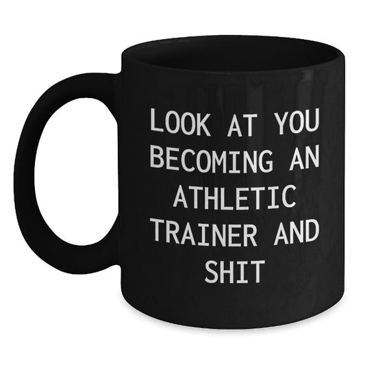 Funny Athletic Trainer Gifts for Him, Men, or Friends, 'Look At You Becoming An Athletic Trainer And Shit' Black Coffee Mug, Unique Graduation Gift - Main