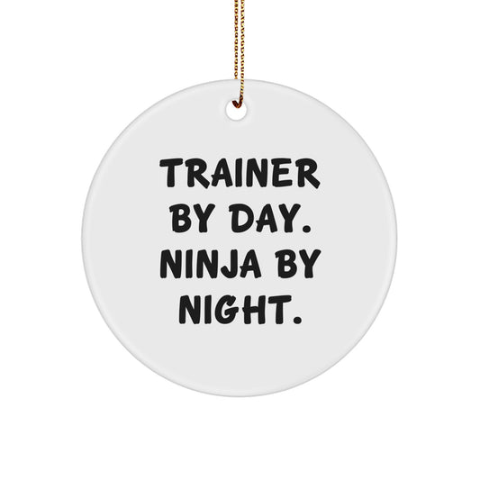Trainer Gifts from Men: Christmas Unique Trainer Circle Ornament, 'Trainer By Day. Ninja By Night.' Quote, White Circle Shaped, MDF Material, Sublimation Print, 2.75'' Tall, 0.5 oz, Gold Cord - Image 1