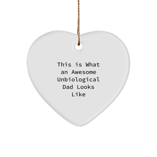 Funny Unbiological Dad Gifts for Christmas - Heart Ornament with 'This Is What An Awesome Unbiological Dad Looks Like' Quote, Gifts from Family for Unbiological Dad - Image 1