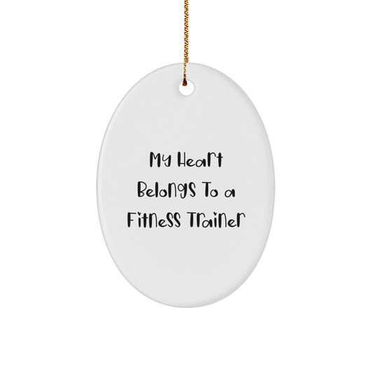 Funny Fitness Trainer Gifts, Oval Ornament, My 'Heart Belongs To A Fitness Trainer' Gifts from Friends and Family for Christmas - Image 1