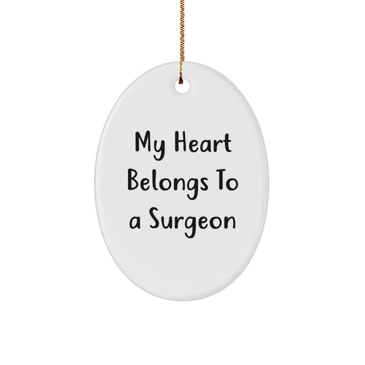 Funny Christmas Unique Gifts from Friends for Surgeon - Oval Ornament with My Heart Belongs To A Surgeon Quote, Perfect Unique Gift for Medical Professionals - Image 1