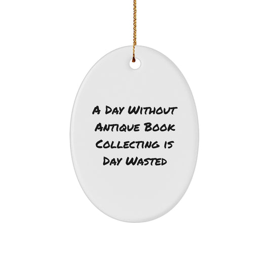Antique Book Collecting Fun, 'A Day Without Antique Book Collecting Is Day Wasted' Oval Ornament Gifts for Men, Women, Friends, or Family from Gifts from Home - Image 1