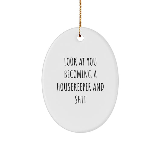 Funny Housekeeper Gifts, Oval Ornament, Christmas Unique Presents, 'Look At You Becoming A Housekeeper And Shit', from Friends to Family, for Housekeeper - Image 1